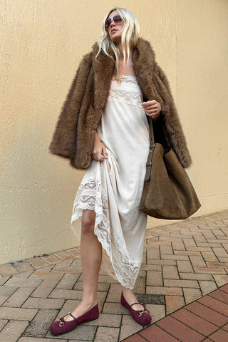 marina-styling-golden-brown-recycled-polyester-faux-fur-coat-over-cream-lace-trim-dress-street-setting