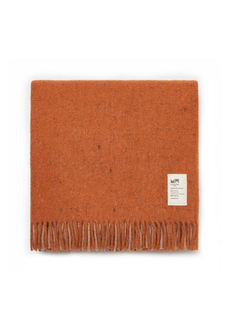 a-folded-orange-brown-wool-scarf-with-fringe-on-one-end-and-a-small-white-brand-label-photographed-on-a-clean-white-background
